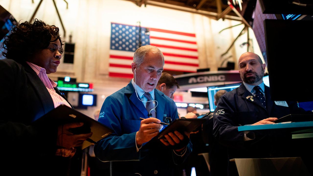 Traders work during the opening bell at the New York Stock Exchange at Wall Street in New York City.