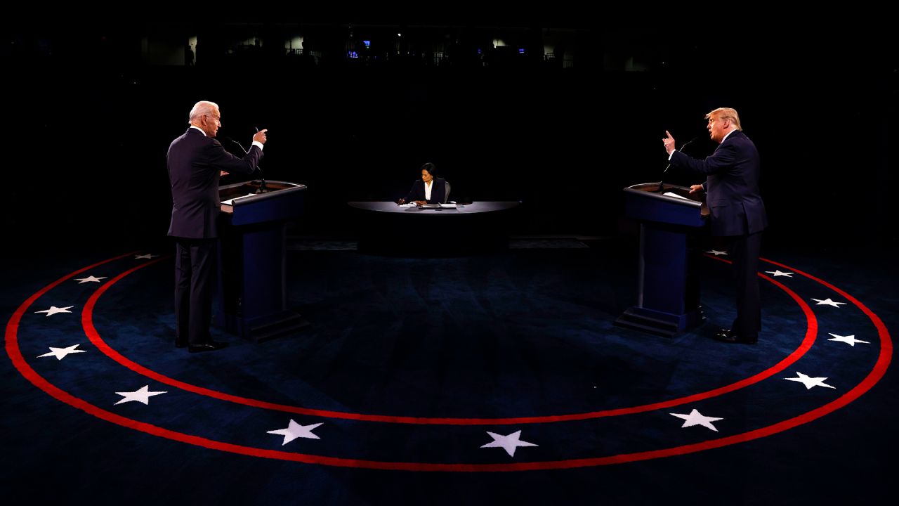 Then-President Donald Trump, right, and Democratic challenger Joe Biden debate each other in Nashville, Tennessee, on October 22, 2020. At center is moderator Kristen Welker of NBC. 