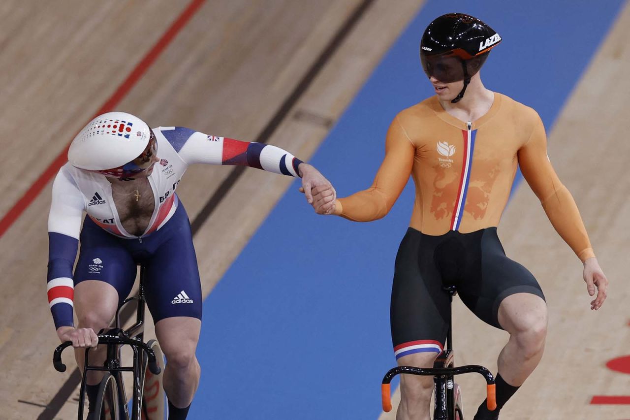 Gold medalist Harrie Lavreysen of the Netherlands, right, is congratulated by Great Britain's Jason Kenny in the men's track cycling team sprint finals on Tuesday. 