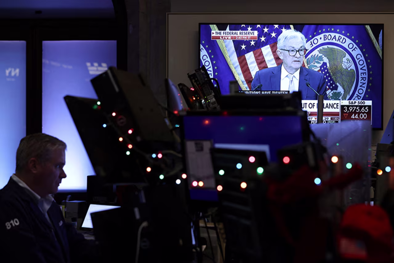 Screens on the trading floor at New York Stock Exchange display the Federal Reserve Chair Jerome Powell during a news conference after the Federal Reserve announced interest rates will raise half a percentage point today.