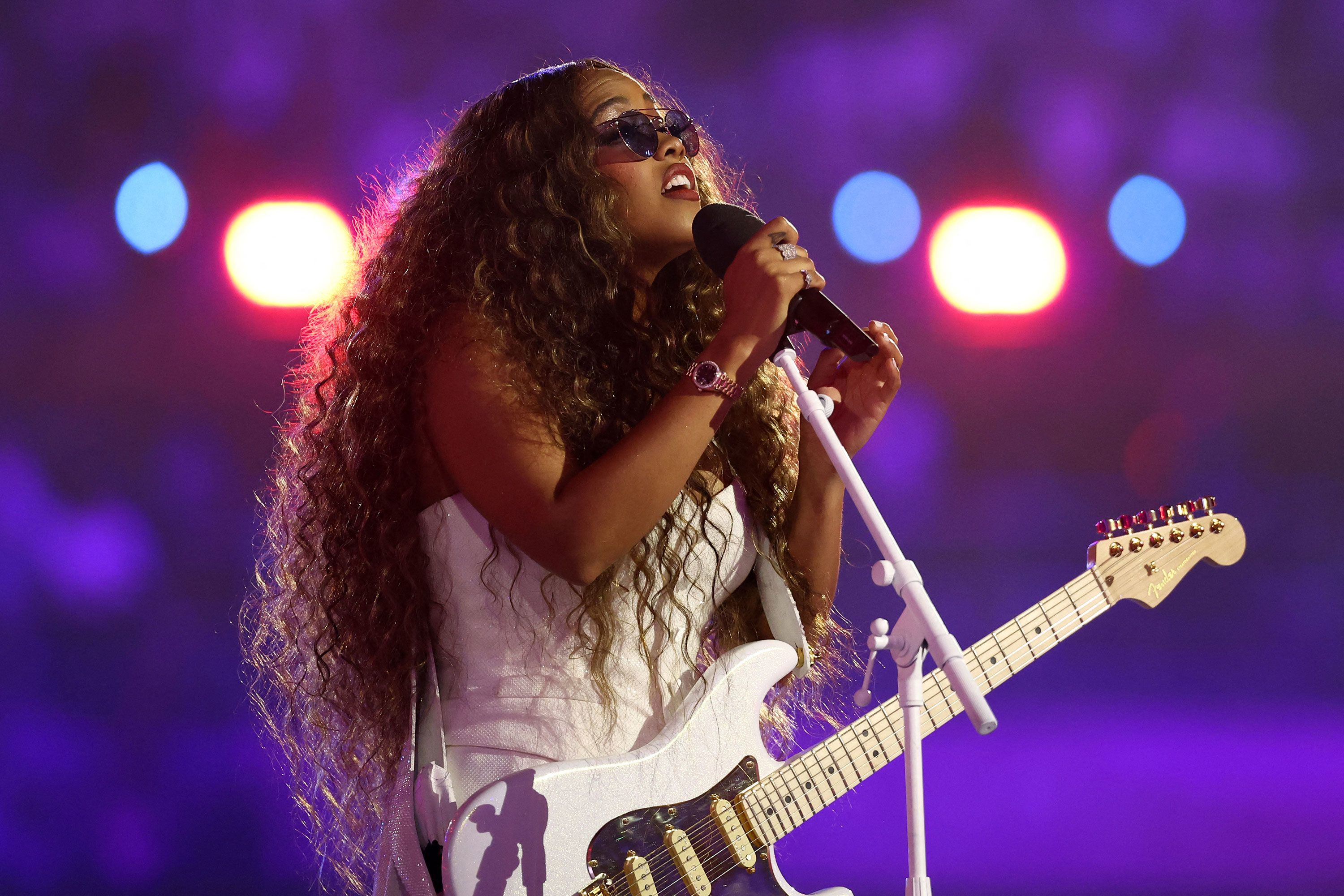 Singer H.E.R performs the US national anthem at the Stade de France.