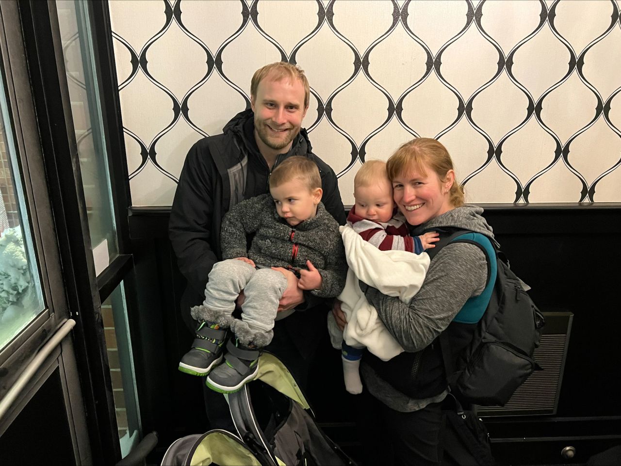 Nathan and Olivia Becker pose for a photo with their children in Iowa.