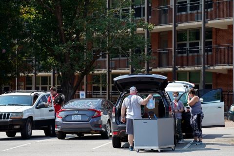 Students and parents begin to move belongings out of Bragaw Hall at North Carolina State University in Raleigh, North Carolina, on August 27.