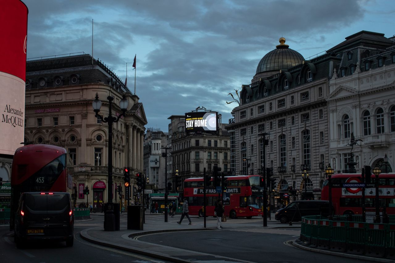 A public service notice encouraging people to stay home is displayed over Picadilly Circus on November 9 in London.