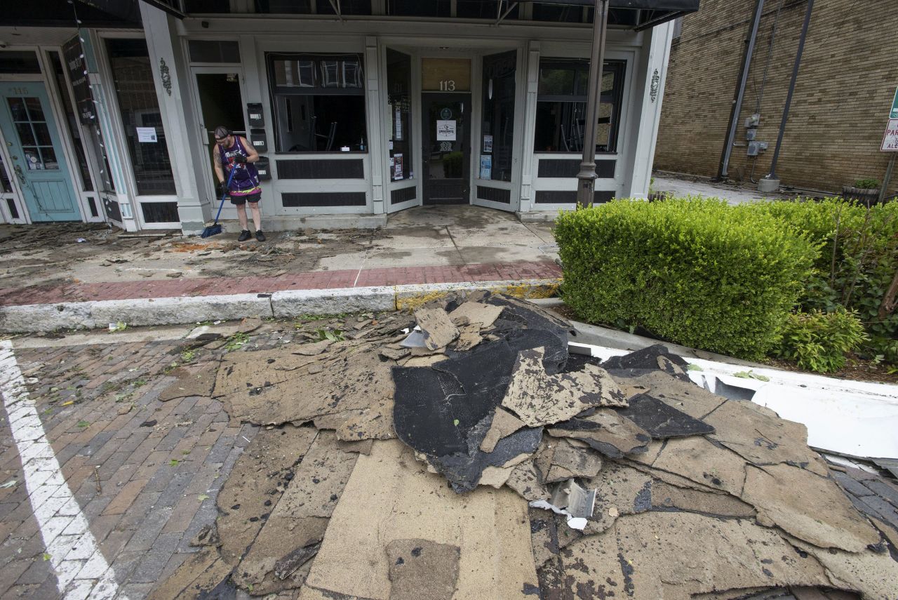 Glass and debris are seen at OZ Smokehouse in Rogers, Arkansas, on May 26. A tornado the previous night caused extensive damage to the downtown area.