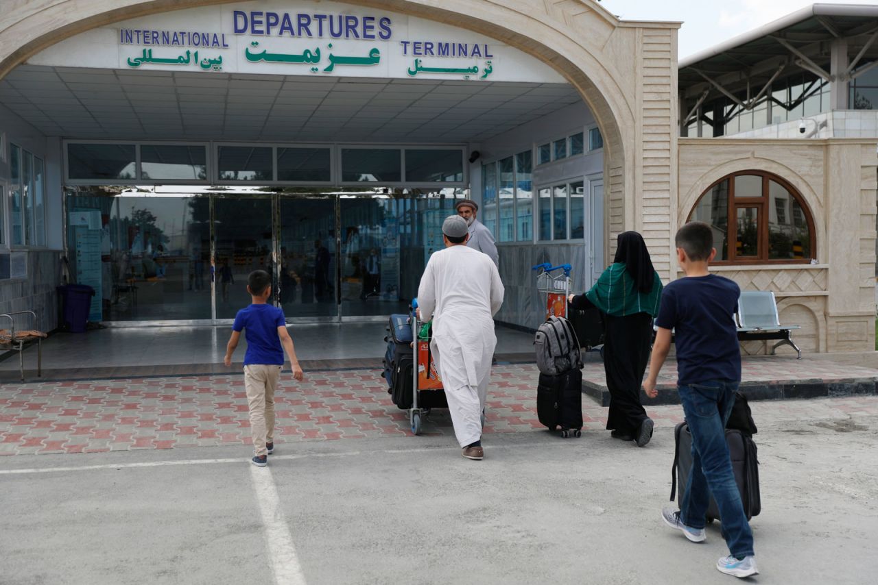 Passengers enter the departures terminal of Hamid Karzai International Airport, in Kabul, Afghanistan, on August 14.