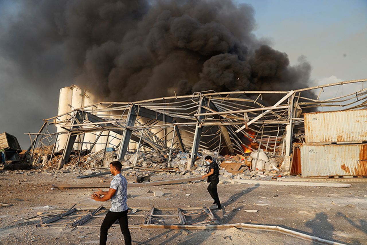 Lebanese security officers arrive at the scene of an explosion that hit the seaport of Beirut, Lebanon, Tuesday, August 4. 