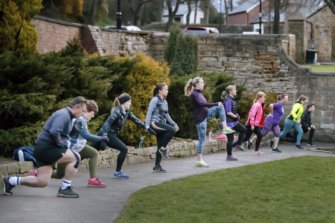 People take part in an exercise class, following the easing of England's lockdown, on Monday March 29, in Rothwell, West Yorkshire. 