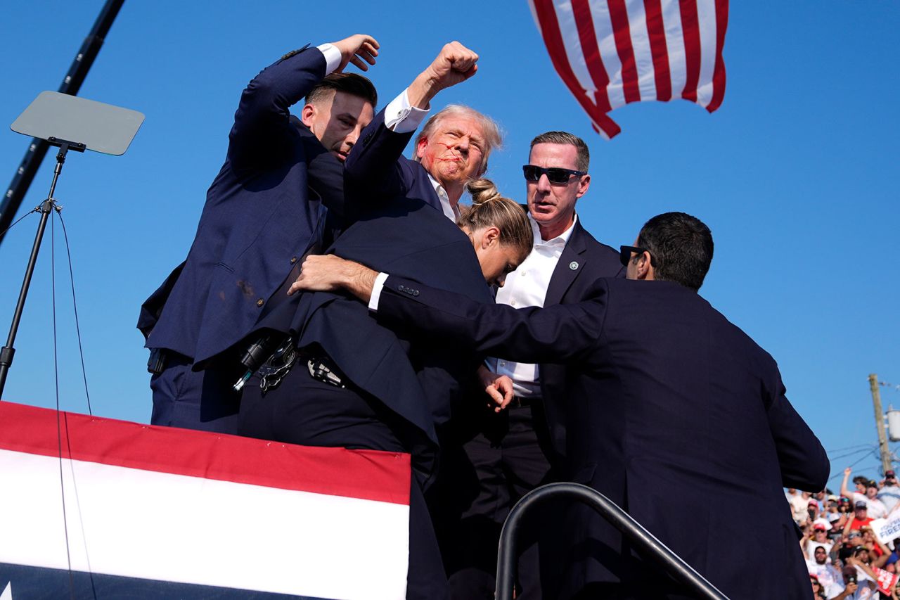 Republican presidential candidate former President Donald Trump is surrounded by Secret Service agents at a campaign rally on Saturday, July 13, in Butler, Pennsylvania. 