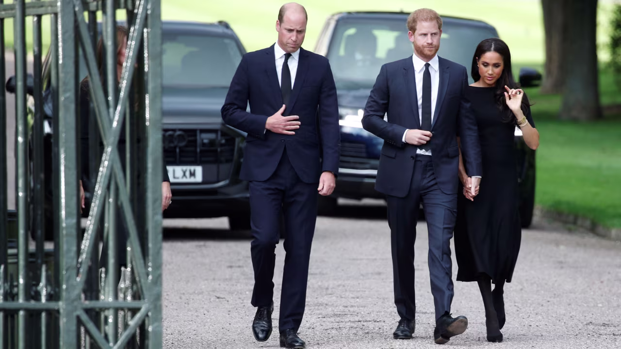 Prince William walks with his brother, Prince Harry, and Meghan, the Duchess of Sussex, on Saturday.