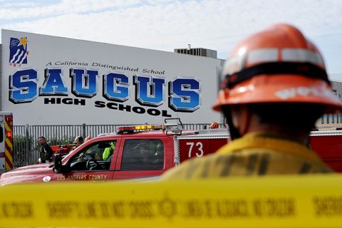 First responders standby for any injured students after a gunman opened fire at Saugus High School.