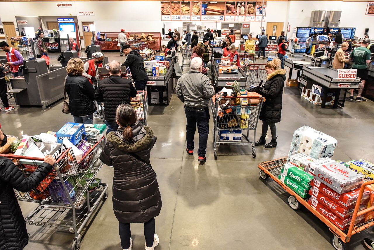 Customers check out at a Costco store in Teterboro, New Jersey on February 28.