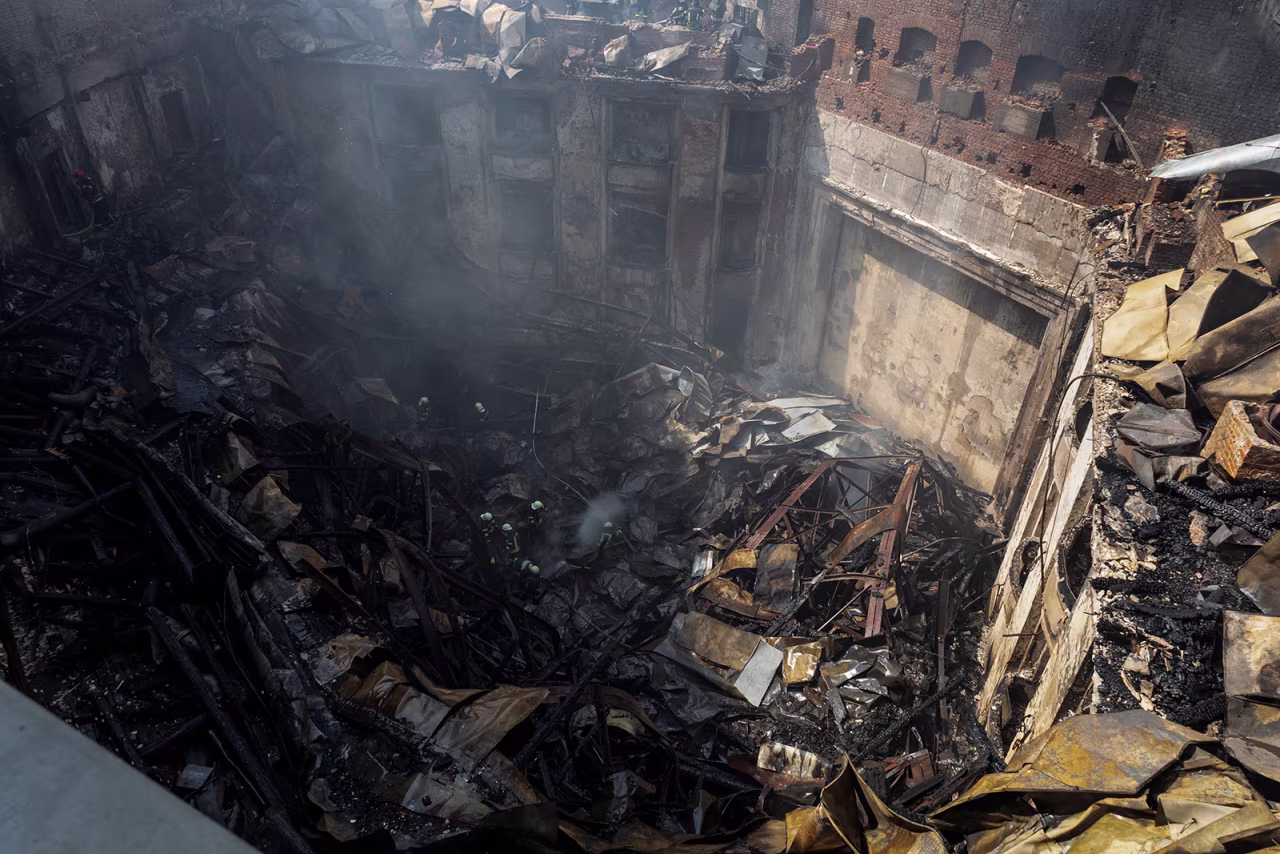 Firefighters work at the site of a House of Culture hit by a Russian missile strike, amid Russia's attack on Ukraine, in Kharkiv, Ukraine on August 18, 2022. 