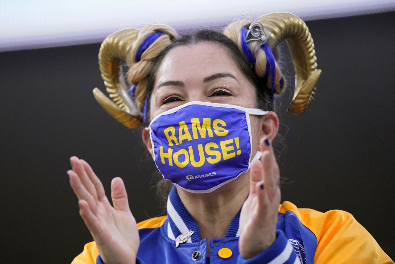 A Los Angeles Rams fan watches players warm up before an NFL wild-card playoff football game between the Rams and the Arizona Cardinals on January 17 in Inglewood, California.