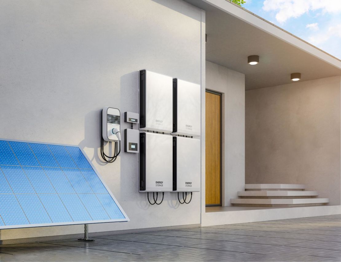 Solar batteries are attached to a residential home.