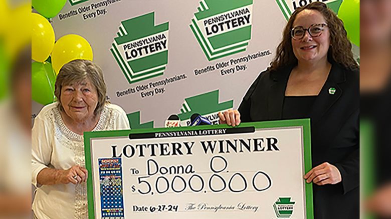 Winner Donna Osborne and PA Lottery Deputy Director of Corporate Sales Staci Coombs.