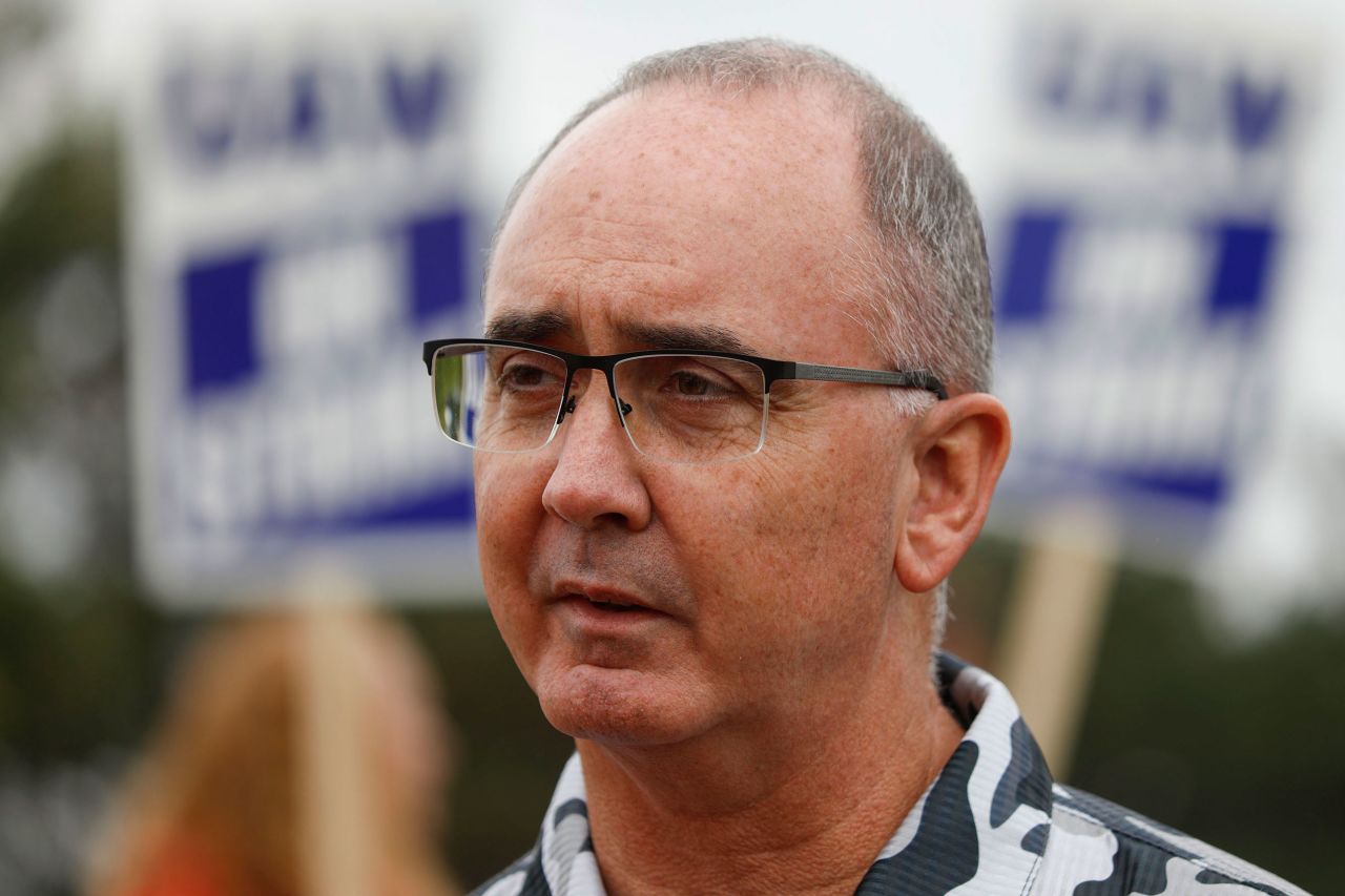 United Auto Workers President Shawn Fain speaks to reporters during a UAW strike at the General Motors Lansing Delta Assembly Plant in Lansing, Michigan, on September 29, 2023. 