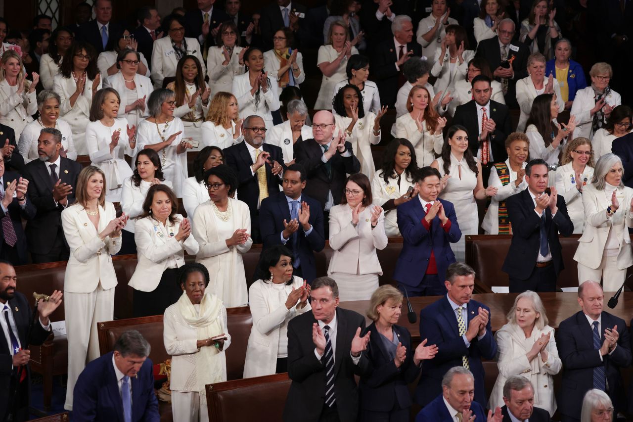 Members of the Democratic caucus wear white for woman's rights during President Joe Biden's State of the Union address.