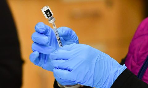 A nurse loads a syringe with a dose of the Pfizer Covid-19 vaccine at the Blood Bank of Alaska in Anchorage on March 19, 2021.