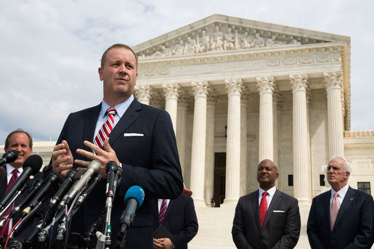 In this September 9, 2019 file photo, Missouri Attorney General Eric Schmitt speaks in front of the US Supreme Court in Washington. 