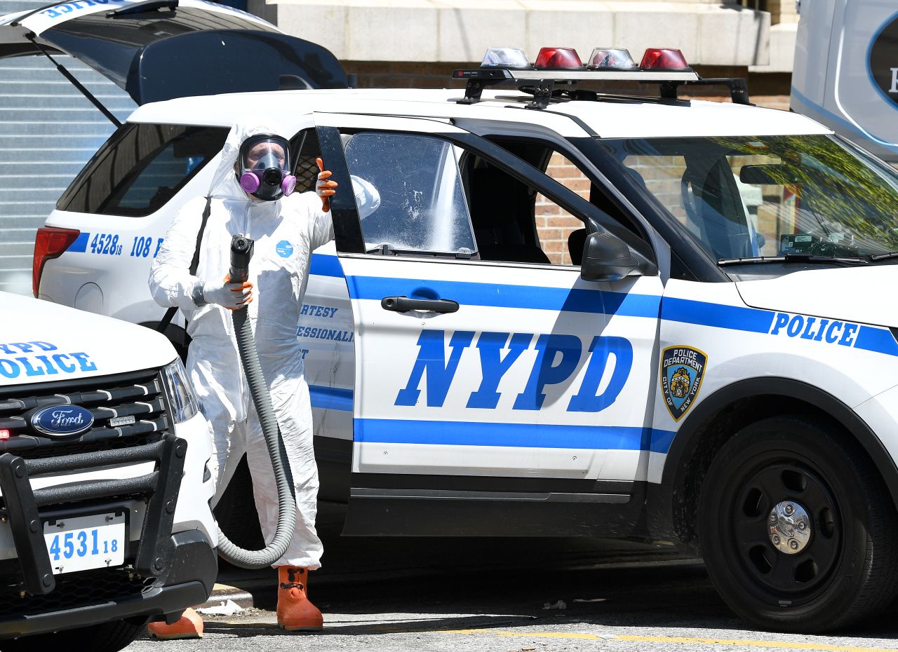 Police ramp up vehicle cleaning procedures in Queens, New York City, on April 28.