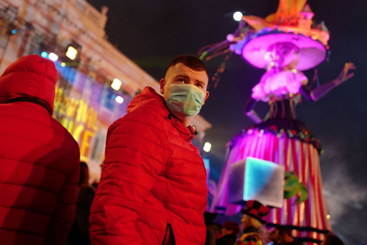 A revellers wears a protective mask at the Nice carnival celebrations on February 25.