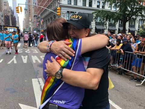 Monica Helms, creator of the transgender pride flag, hugs another participant at the Pride march.