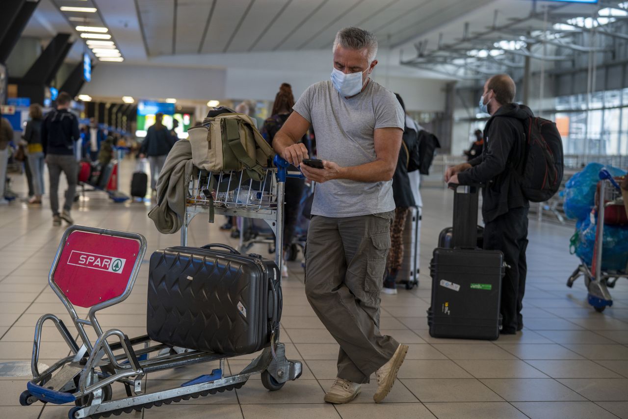 People lineup to get on the Air France flight to Paris at OR Tambo's airport in Johannesburg, South Africa, Friday November 26th, 2021. A slew of nations moved to stop air travel from southern Africa on Friday in reaction to news of a new, potentially more transmissible COVID-19 variant that has been detected in South Africa.