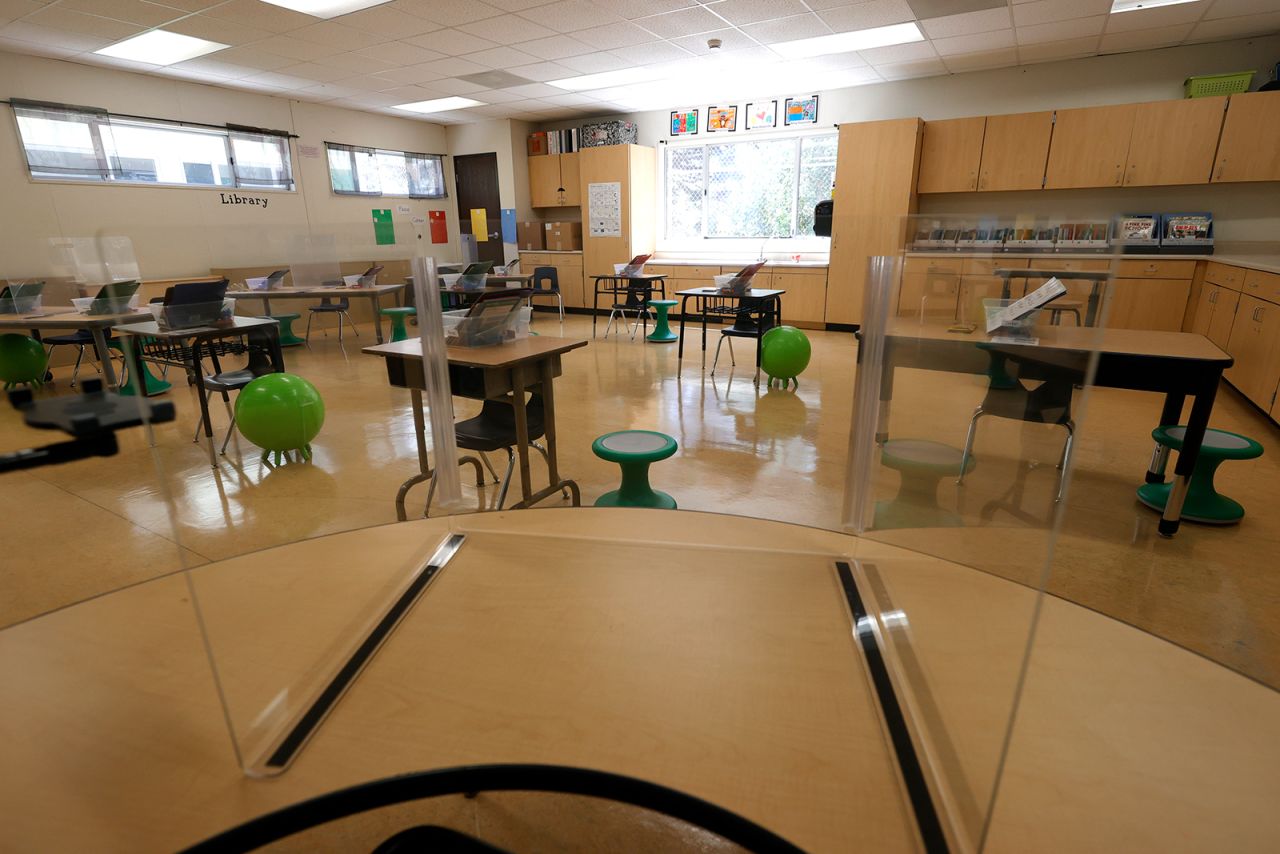 Plexiglass dividers are set up on tables in a first grade classroom at Bryant Elementary School on April 9, 2021 in San Francisco, California. 