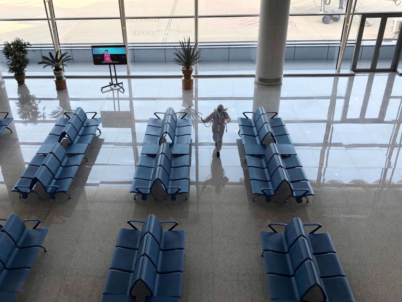 An employee disinfects an area at Pyongyang International Airport in Pyongyang, North Korea, on Monday.