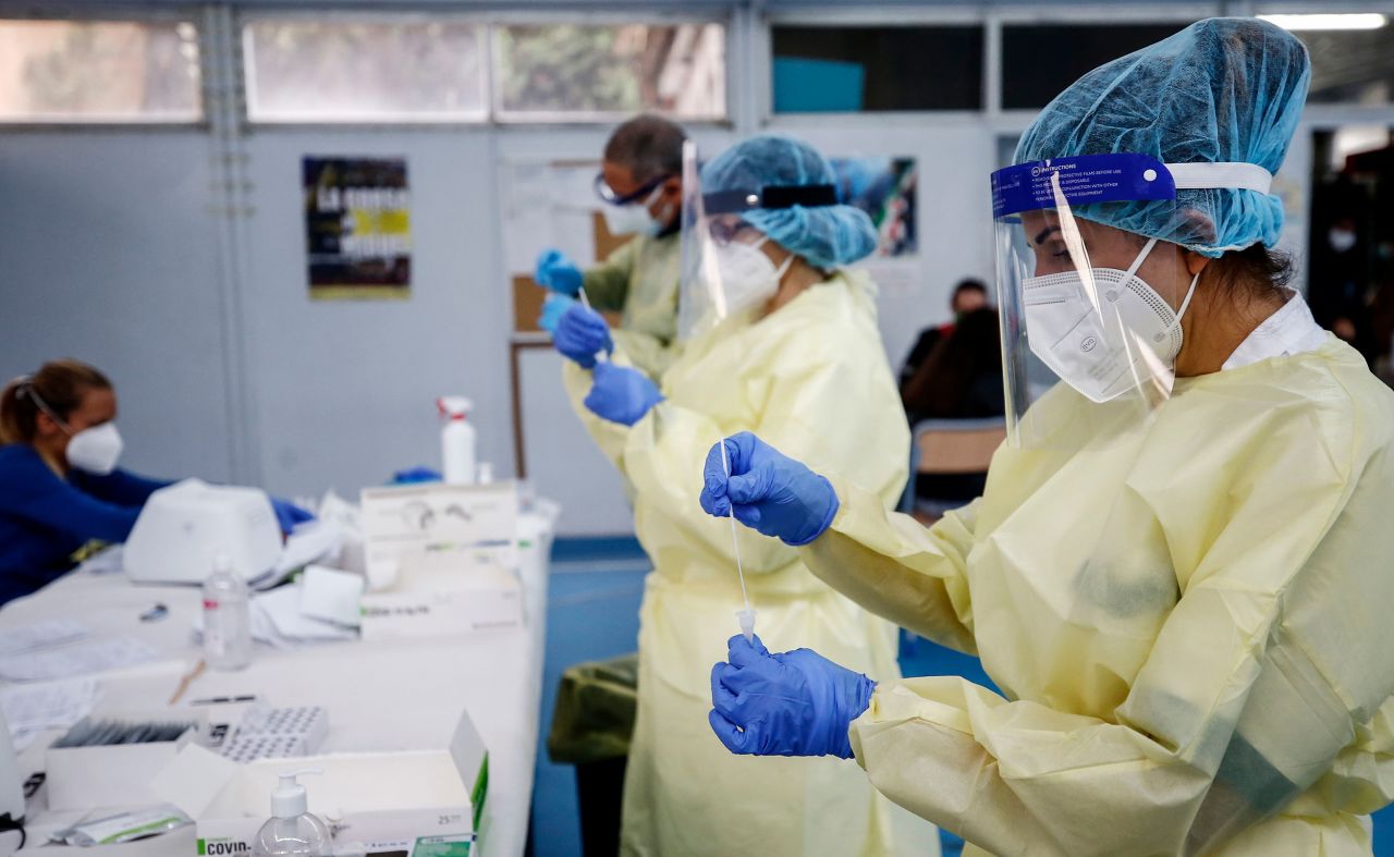 Medical staff holds swabs for rapid Covid-19 tests on September 28 in Rome, Italy.