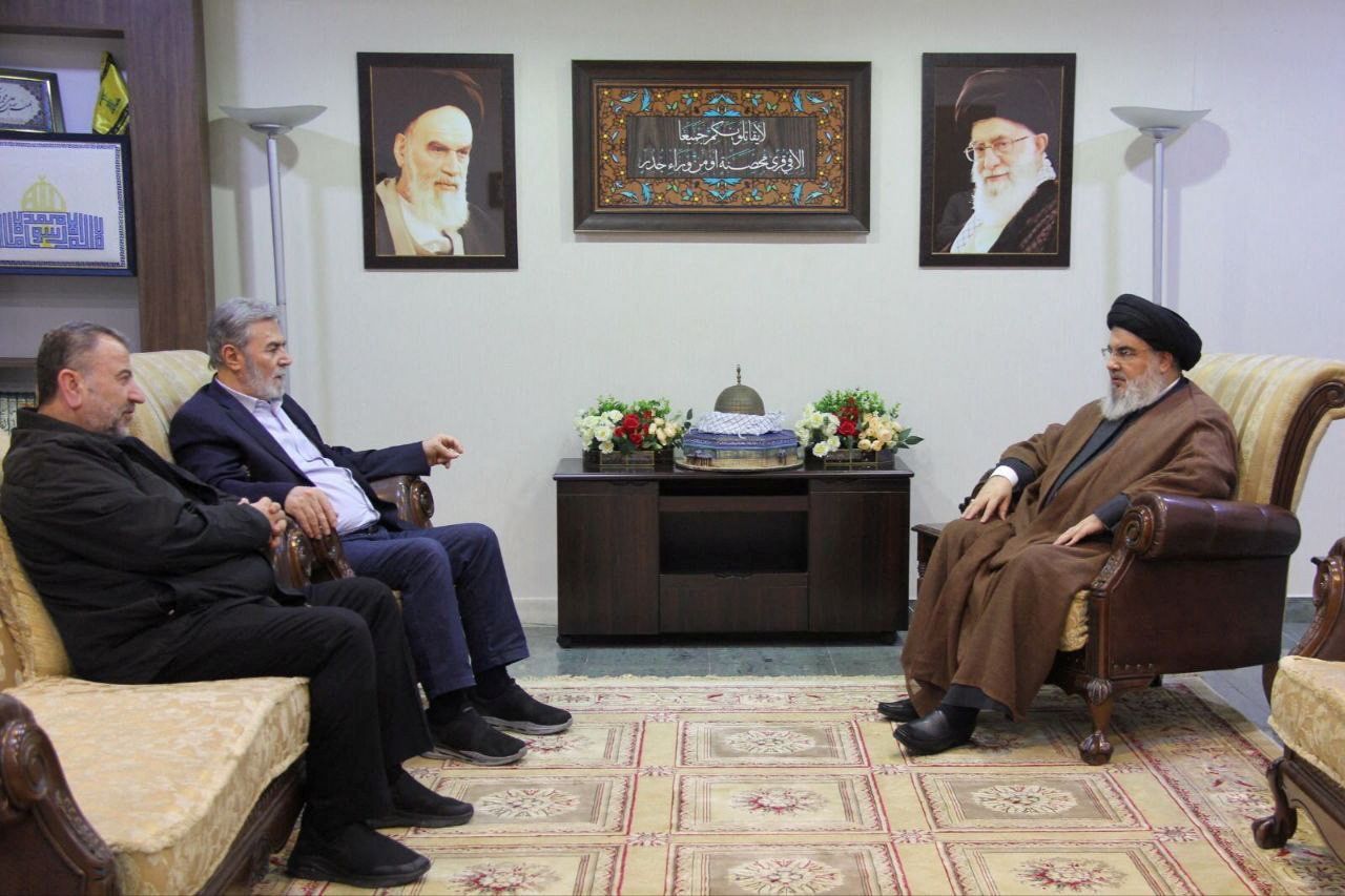 Lebanon's Hezbollah leader Sayyed Hassan Nasrallah, right, meets Jihad Secretary General Ziyad al-Nakhalah and deputy leader of Hamas, Sheikh Saleh al-Arouri at an unidentified location in this handout image released on October 25.