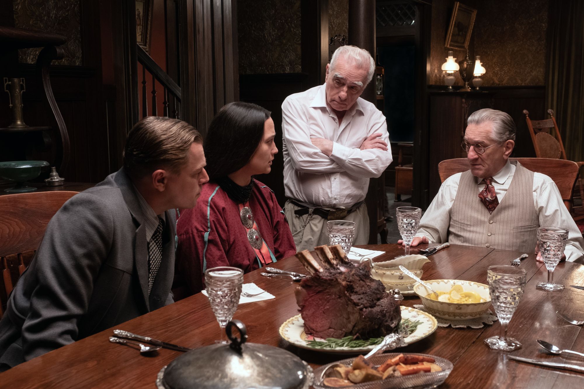 Left to right: Leonardo DiCaprio, Lily Glastone, Martin Scorsese and Robert De Niro discuss a scene during the making of "Killers of the Flower Moon."