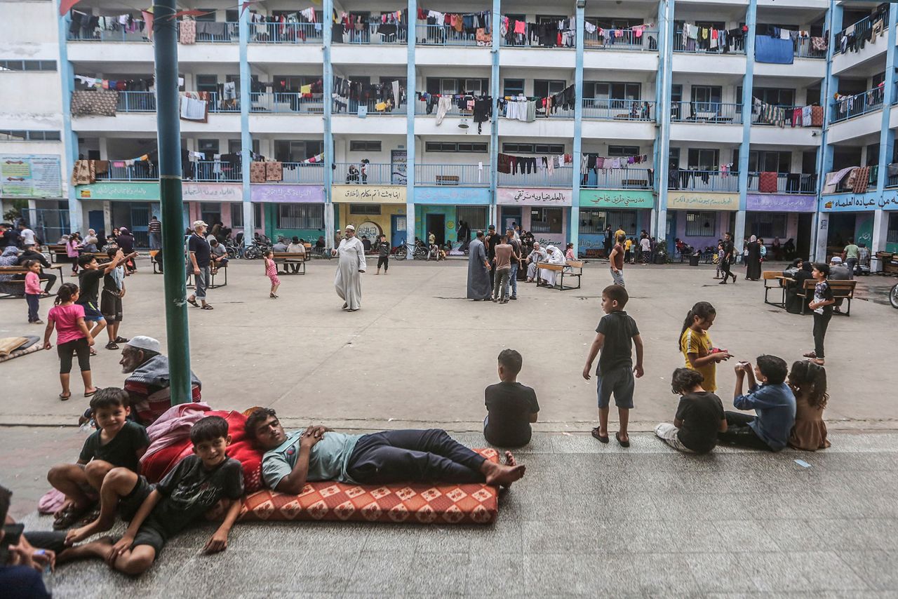 Displaced Palestinians take shelter in a UN school in Khan Yunis on October 16.