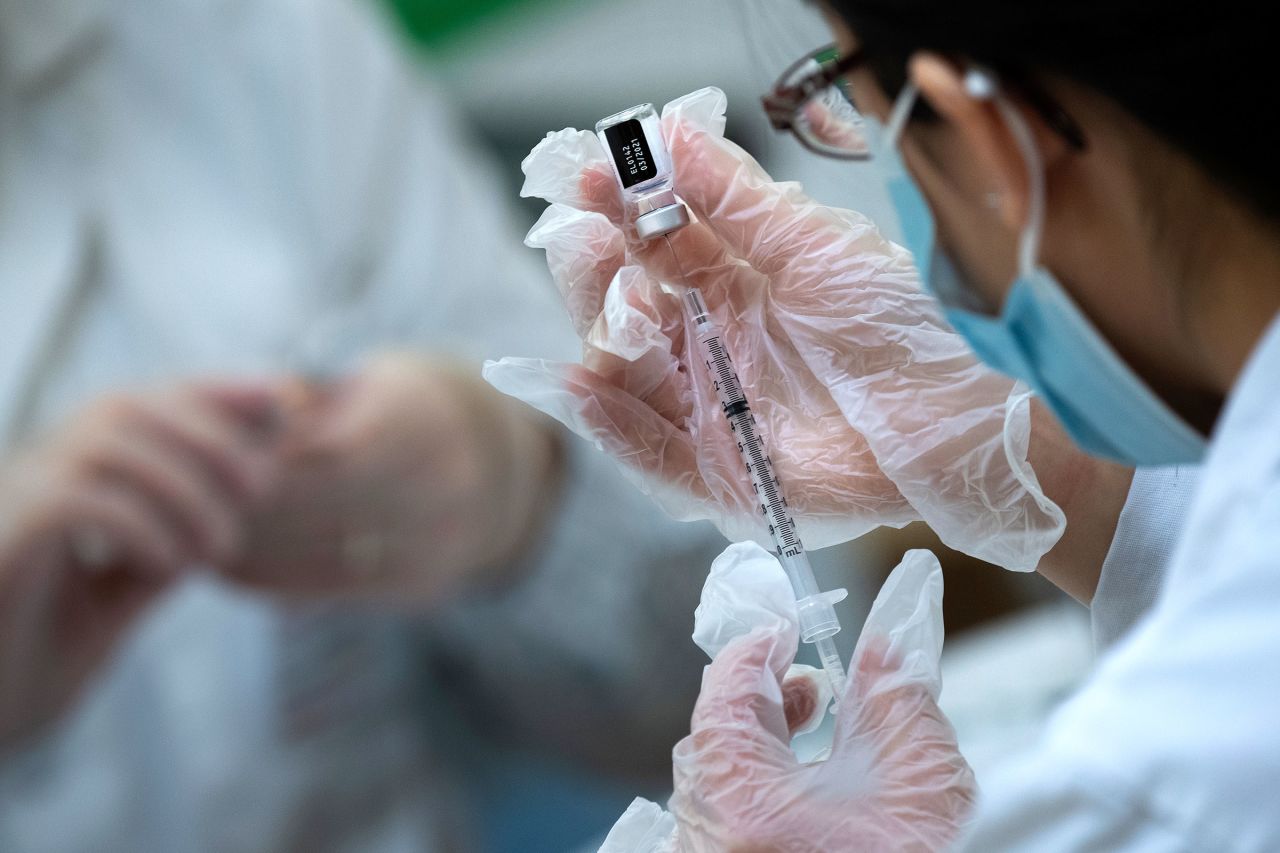 A pharmacist prepares to administer a Covid-19 vaccine to staff and residents at a senior living community in Falls Church, Virginia, on December 30.