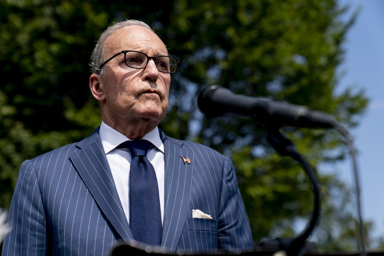 White House economic adviser Larry Kudlow speaks to reporters outside the White House on August 12.