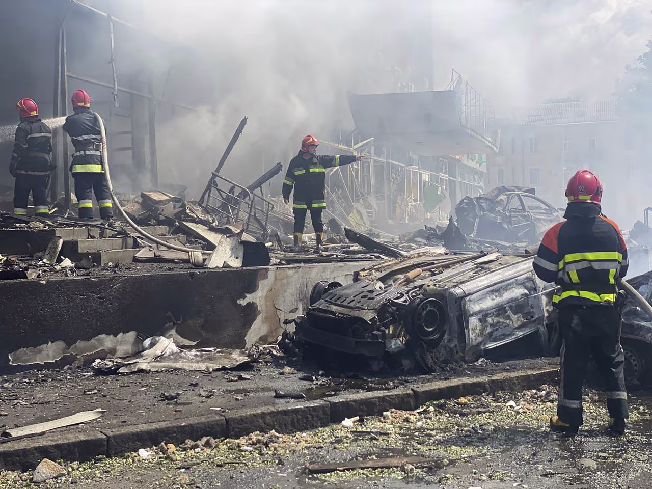 Firefighters work to extinguish fire at a building damaged by shelling, in Vinnytsia, Ukraine, on July 14. 