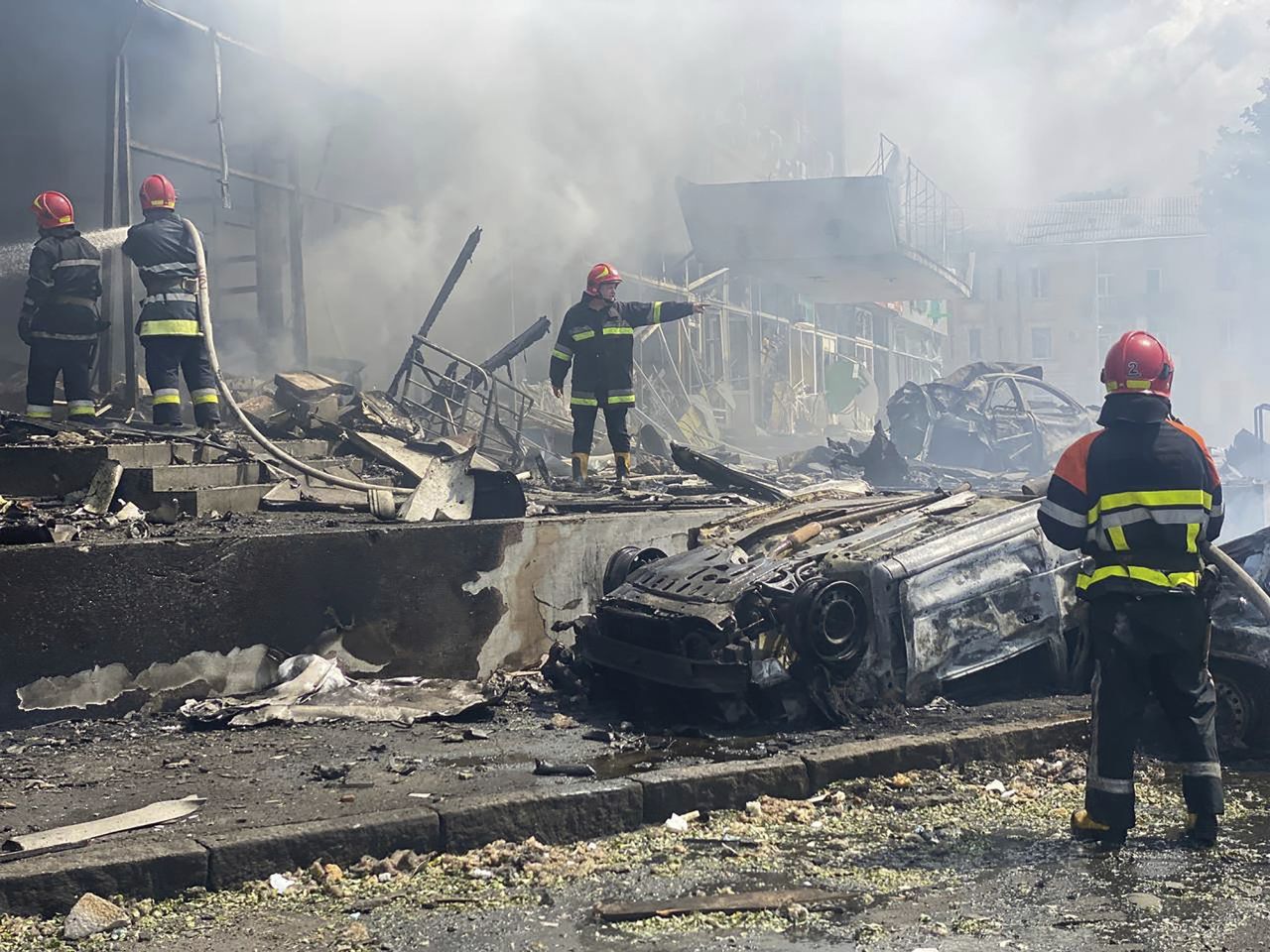 Firefighters work to extinguish fire at a building damaged by shelling, in Vinnytsia, Ukraine, on July 14. 