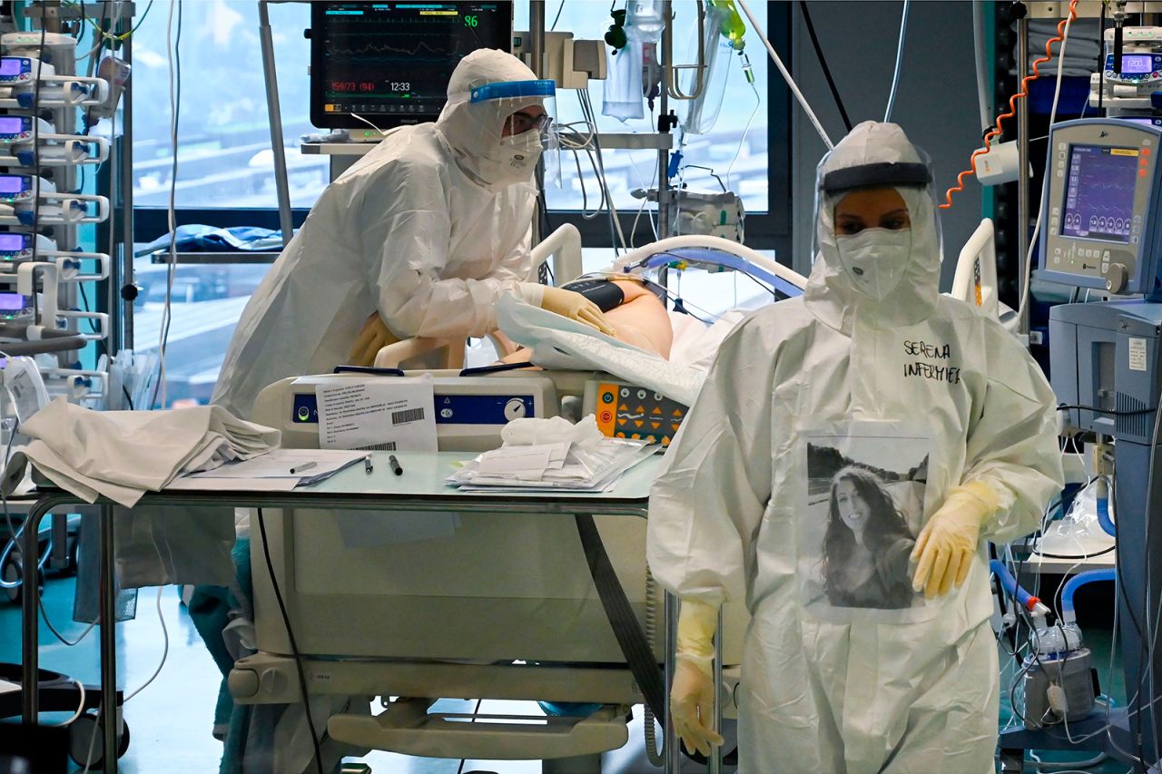 Medical workers of the Covid-19 intensive care unit at the Santo Stefano hospital in Prato, near Florence, tending to a patient on December 17.