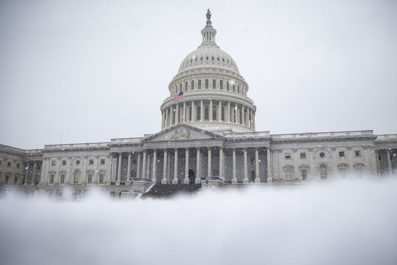  Snow clovers the East Front of the US Capitol, on Sunday