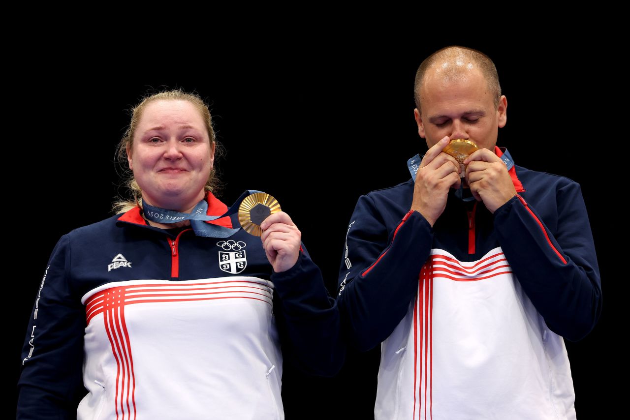 Serbia's Zorana Arunović and Damir Mikec celebrate their gold medal win on the podium on Tuesday.