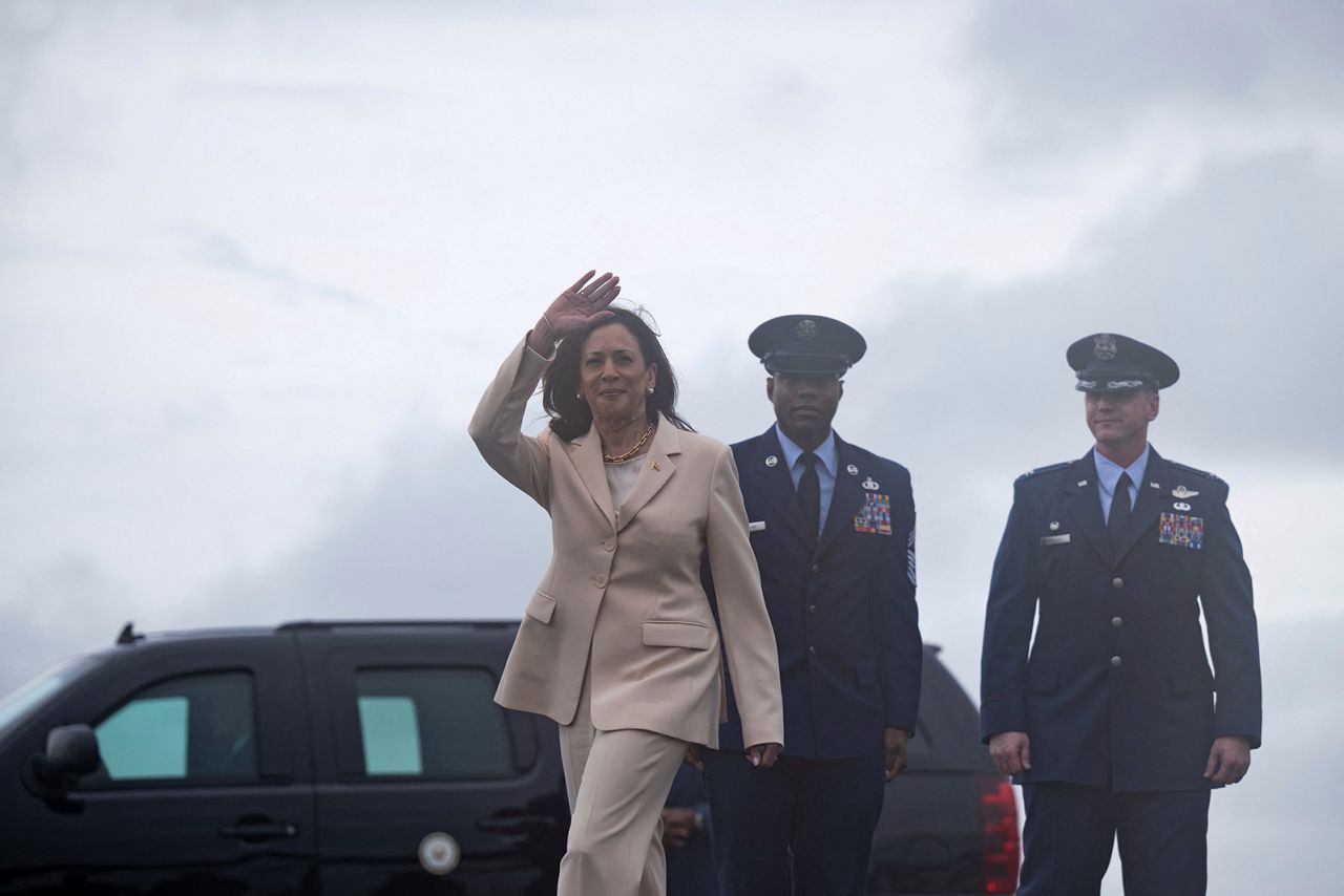 Vice President Kamala Harris waves upon arrival at Ellington Airfield in Houston, Texas, on July 24.