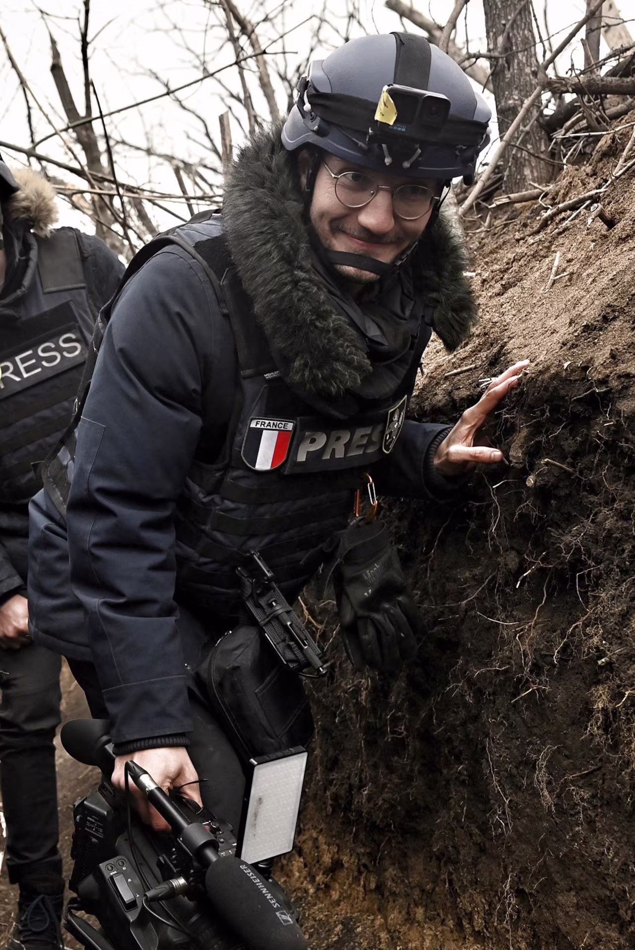 Arman Soldin, a video journalist for Agence France-Presse, walks in a trench as he covers the war in Ukraine on March 18, 2023.