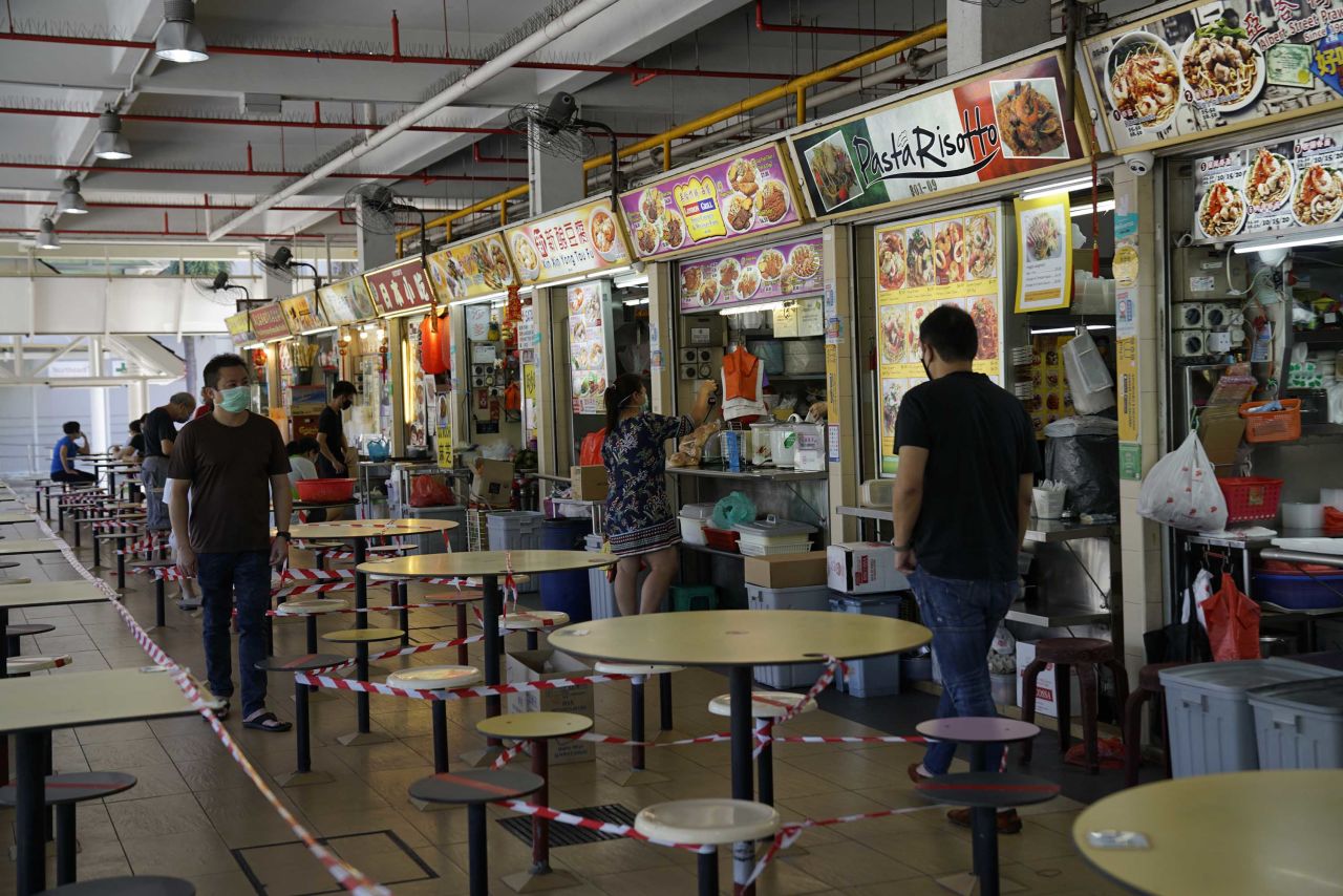 The seating area of a food court is seen taped off during a partial lockdown restrictions in Singapore on April 20.