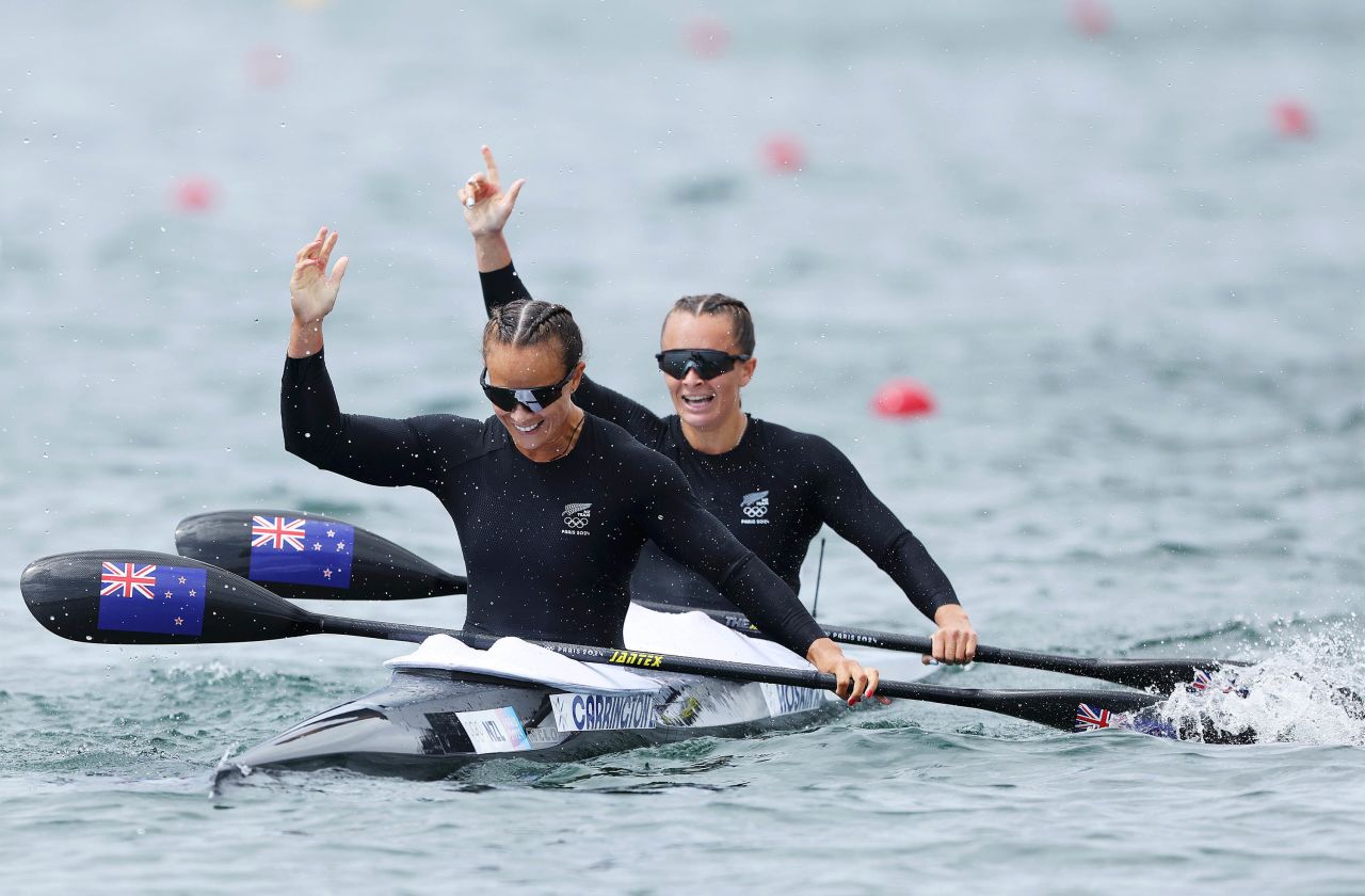 Lisa Carrington and Alicia Hoskin of Team New Zealand celebrate winning gold in the women's kayak double 500m final on Friday. 