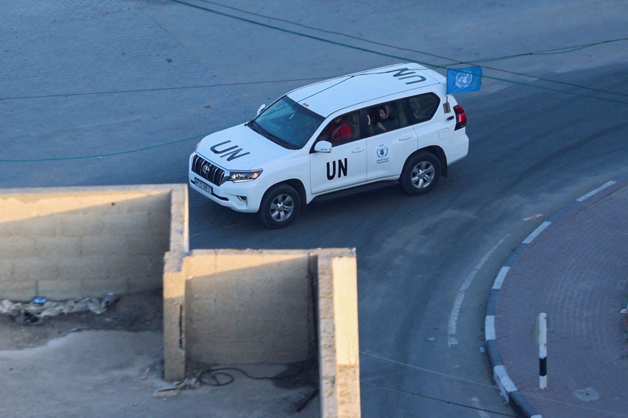 A UN vehicle moves as the Palestinian refugee agency (UNRWA) says it relocated its central operations center and international staff to the south of Gaza, amid Israeli strikes, in Gaza City, on October 13, 2023.