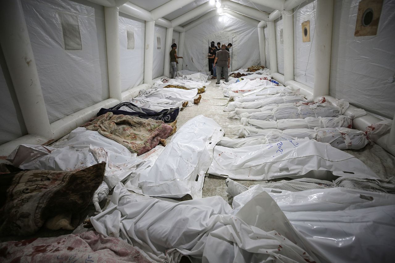 Bodies of Palestinians killed in the blast lie in front of the Al-Shifa Hospital in Gaza City.