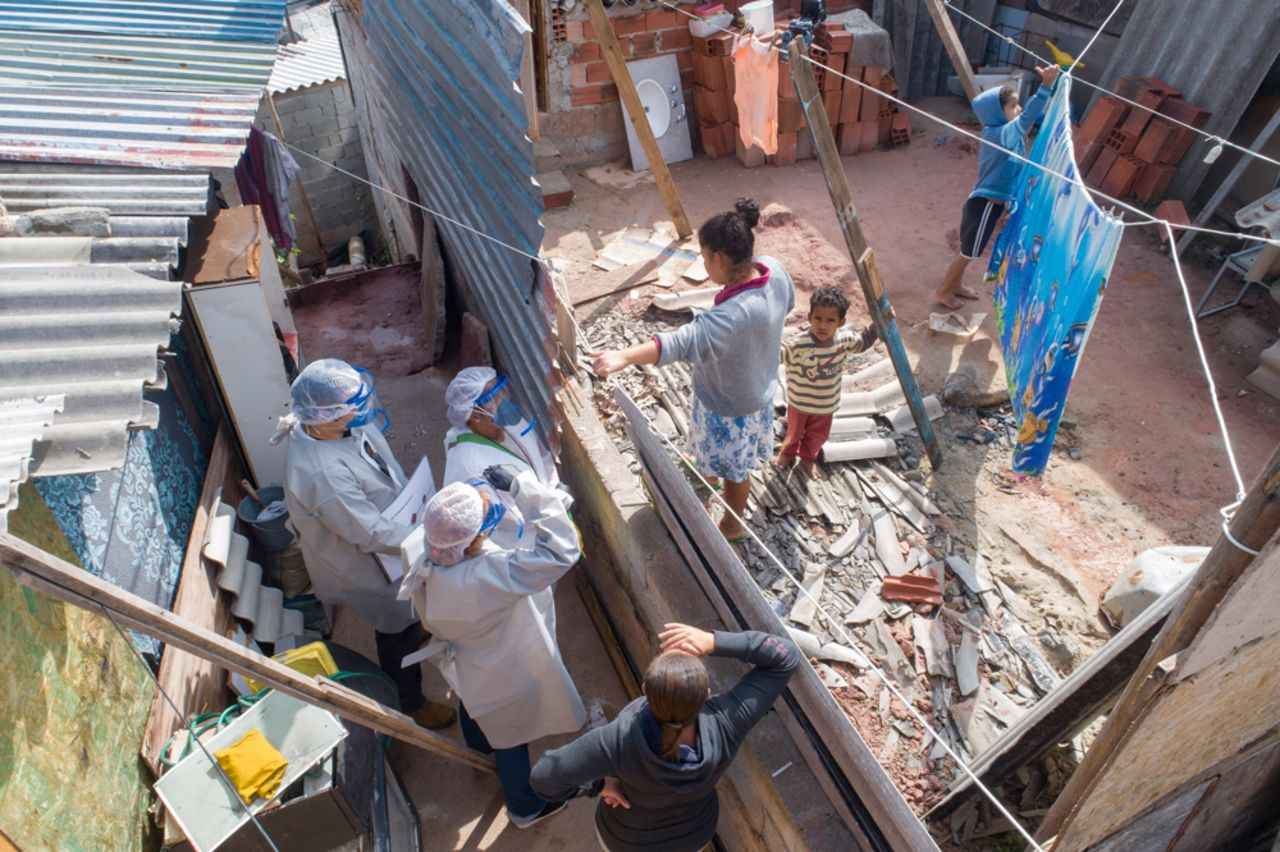 Health workers from Doctors Without Borders visit a squatters camp to conduct medical examinations to avoid the spread of the new coronavirus in Sao Bernardo do Campo in the greater Sao Paulo area of Brazil on Wednesday.