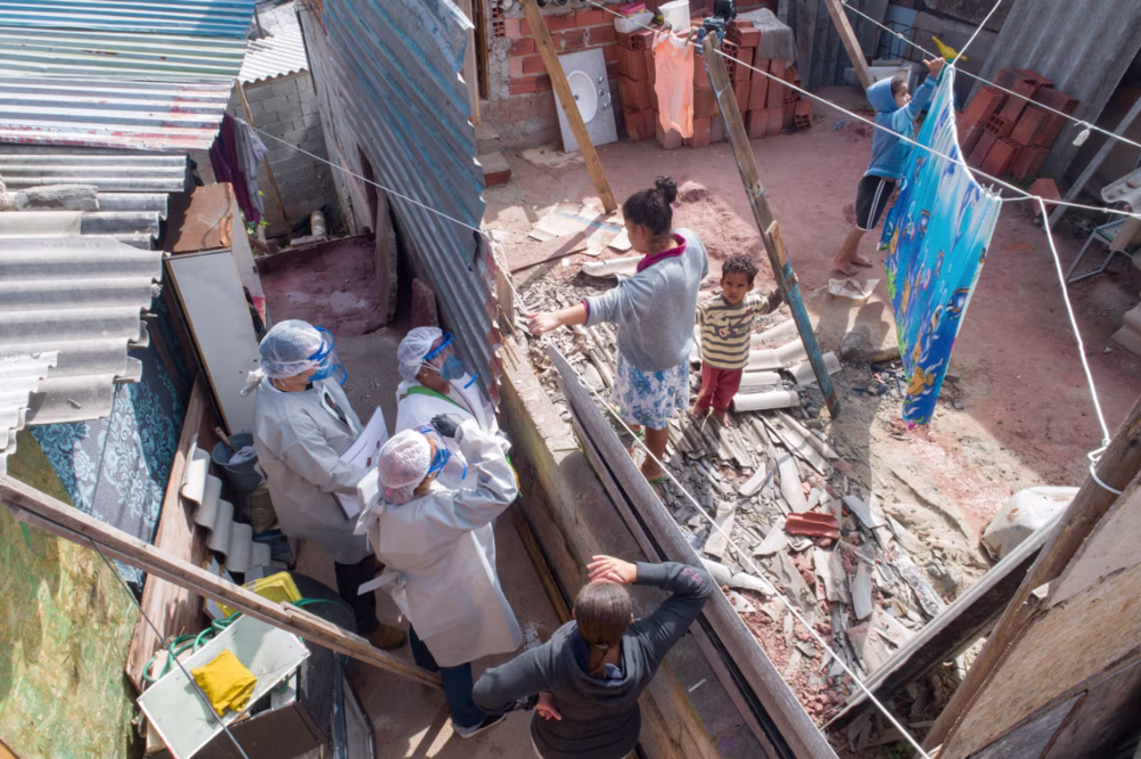 Health workers from Doctors Without Borders visit a squatters camp to conduct medical examinations to avoid the spread of the new coronavirus in Sao Bernardo do Campo in the greater Sao Paulo area of Brazil on Wednesday.