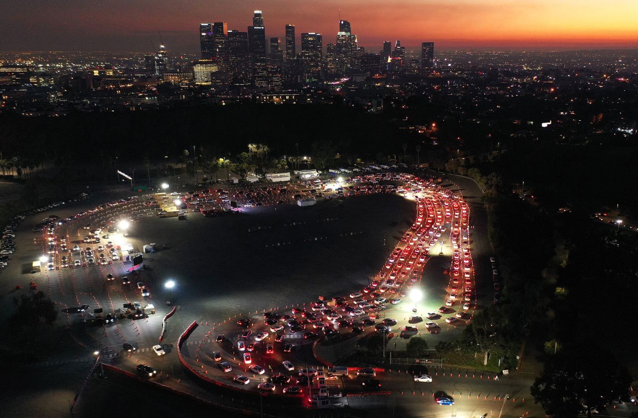 An aerial view of cars are lined up at Dodger Stadium for COVID-19 testing over downtown Los Angeles, on December 2. 